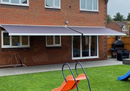 2 Grey Striped Awnings over patio