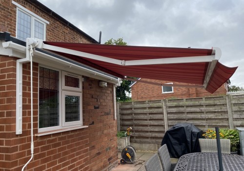 Red Striped Awning with gutter brackets